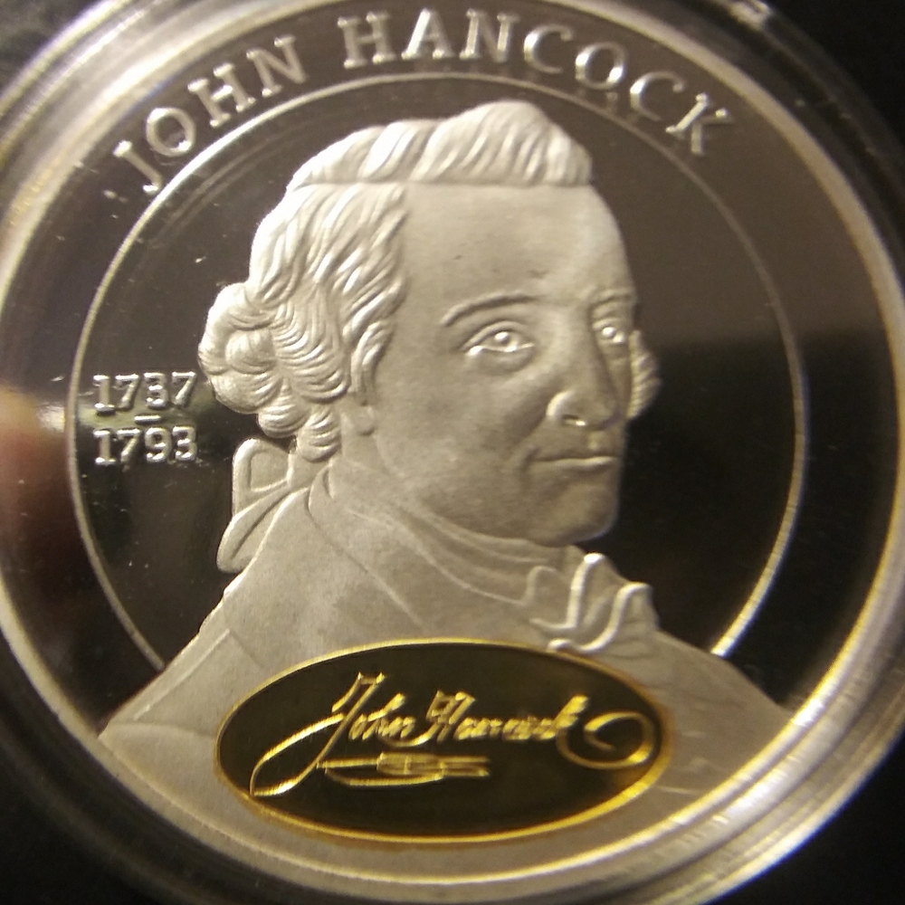 John hancock commertive gold accented coin